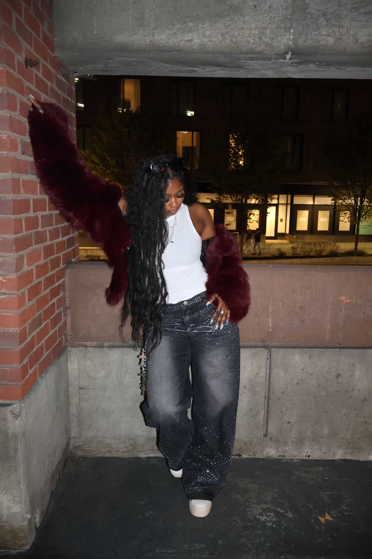 Nighttime styling with burgundy faux fur and embellished denim