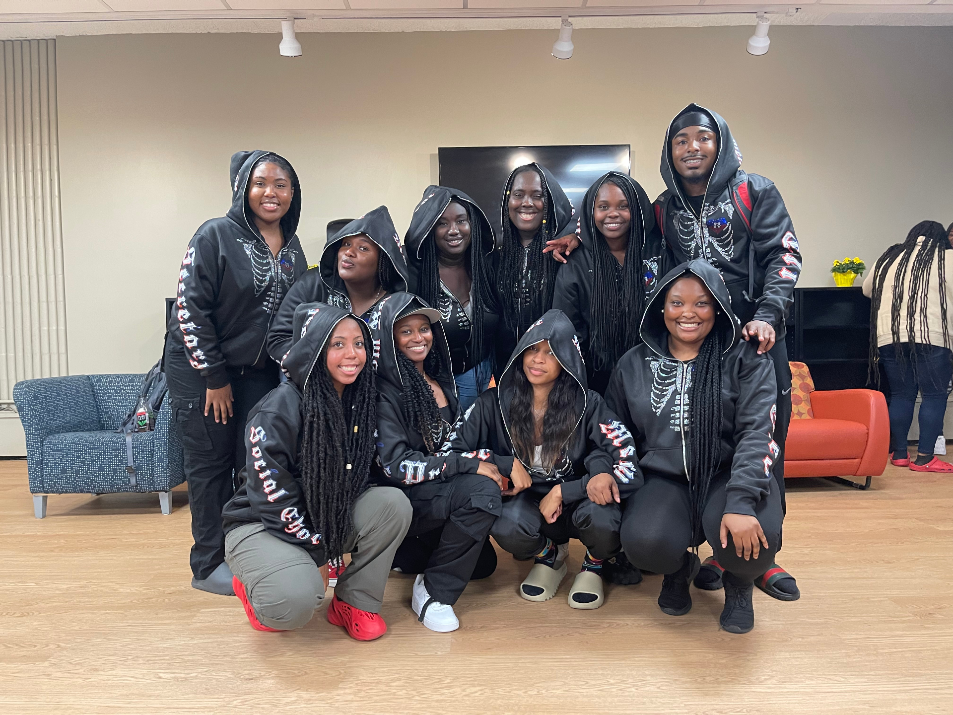 Group wearing custom black skeleton hoodies